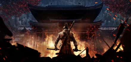 A stunning HD desktop wallpaper for Sekiro: Shadows Die Twice, depicting the game's protagonist standing with swords drawn in a fiery scene before a traditional Japanese temple.