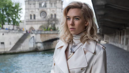 4K Ultra HD wallpaper of Vanessa Kirby as Alanna Mitsopolis, aka White Widow, from Mission: Impossible – Fallout, standing by a river with a historic building in the background.