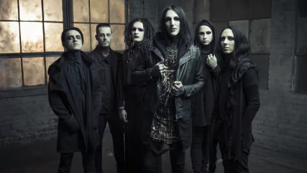 HD desktop wallpaper featuring the American metal band Motionless in White posing in dark attire against an industrial background.