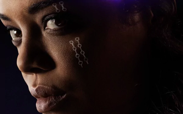 HD desktop wallpaper featuring Tessa Thompson as Valkyrie from Marvel Comics' movie Avengers: Endgame, showcasing a close-up of her face with intricate designs.