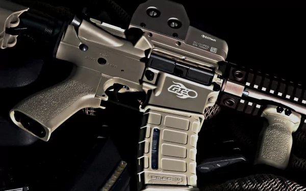 Close-up of a modern airsoft rifle in tan, showcasing detailed components against a dark background. A sleek design makes it an engaging HD desktop wallpaper.
