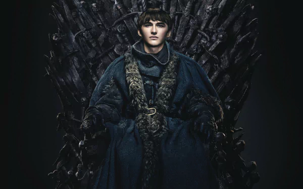 Bran Stark from Game of Thrones seated on the Iron Throne in a dark fur-lined cloak; 2K Quad HD PC desktop wallpaper/background.