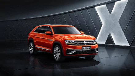 Orange Volkswagen Teramont SUV showcased in a sleek, modern setting, captured as a 4K Ultra HD desktop wallpaper highlighting its bold design and details.