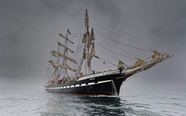 HD PC desktop wallpaper of a majestic barque sailboat vehicle with full masts gliding on calm gray seas beneath an overcast sky.