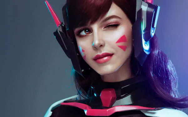 Close-up of a woman cosplaying D.Va from Overwatch, winking with lipstick, captured in 4K Ultra HD for a PC desktop wallpaper.