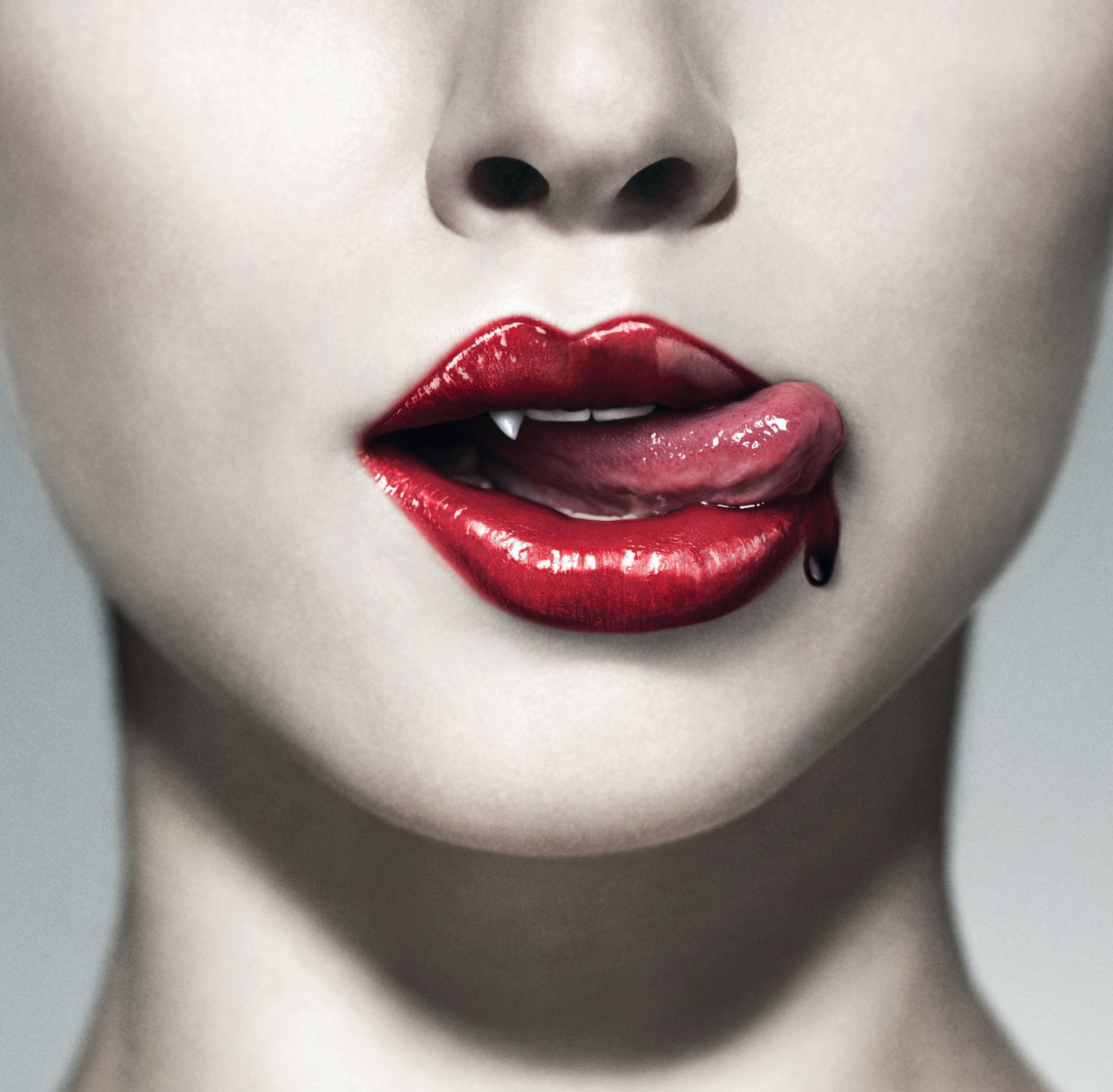 A striking HD wallpaper from the TV show True Blood, featuring close-up lips with glossy red lipstick and fangs, creating a bold and vampiric aesthetic.