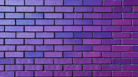 A 4K Ultra HD image of a man-made purple brick wall, showcasing vibrant color and uniform texture as a desktop wallpaper background.