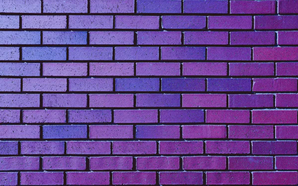 A 4K Ultra HD image of a man-made purple brick wall, showcasing vibrant color and uniform texture as a desktop wallpaper background.
