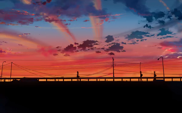 Anime scene from 5 Centimeters per Second showing characters on a bridge with a vibrant sunset background. This HD desktop wallpaper beautifully captures the poignant and serene atmosphere.