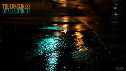 HD PC desktop wallpaper featuring colorful bokeh light reflections on a wet surface at night, evoking a quiet and contemplative mood.