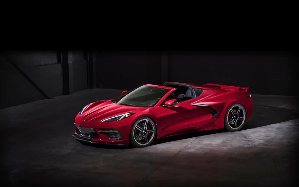 A striking red Chevrolet Corvette (C8) supercar displayed in a dark setting, captured as a 4K Ultra HD PC desktop wallpaper and background.