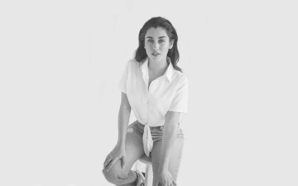 Monochrome 8K Ultra HD image of American singer Lauren Jauregui posing against a plain background, designed as a PC desktop wallpaper.