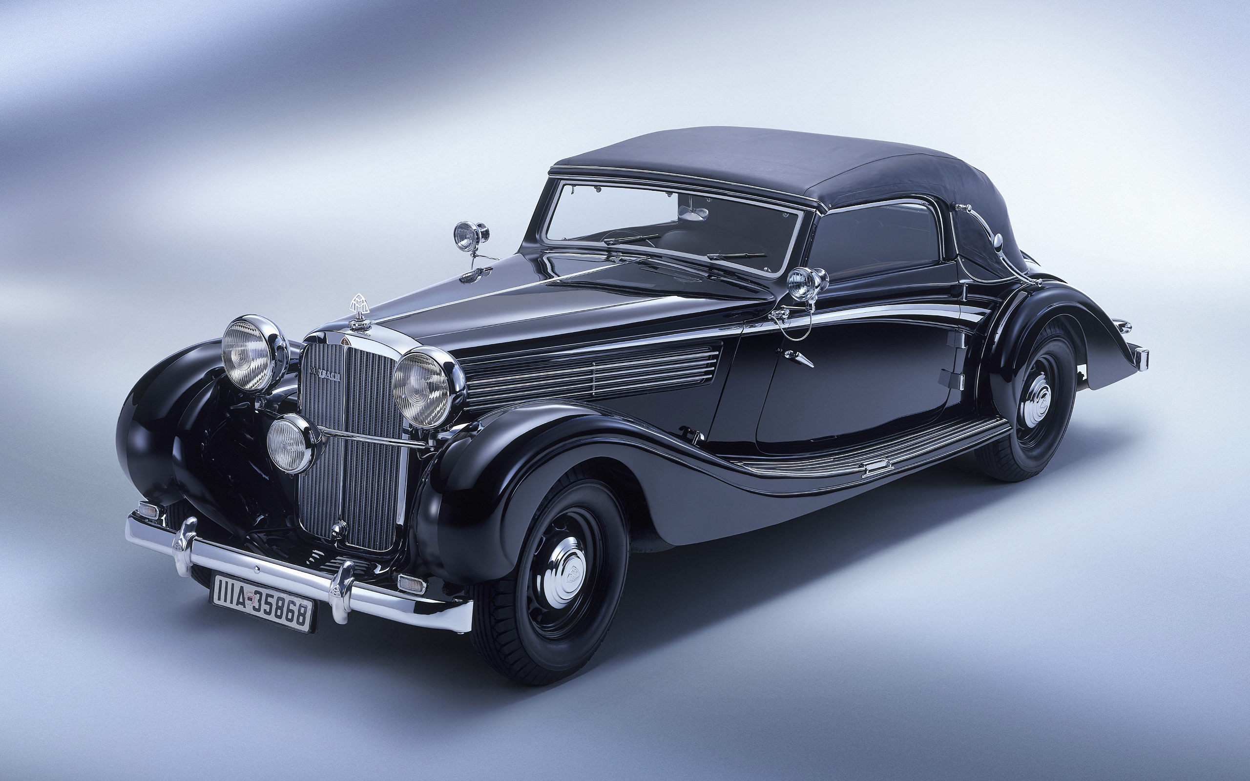 1938 Maybach SW 38 Cabriolet - Luxury vintage vehicle with top down on a desktop wallpaper.