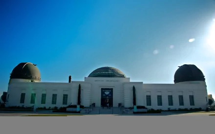 4K Ultra HD image of the iconic Los Angeles observatory under a clear, sunny sky, showcasing its distinct domed, man-made structure.