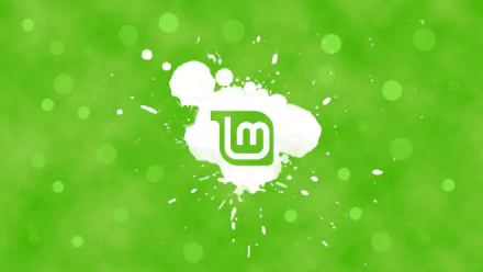 HD Linux Mint desktop wallpaper showing a white Linux Mint logo in a paint-splash over a bright green bokeh background, technology-themed.