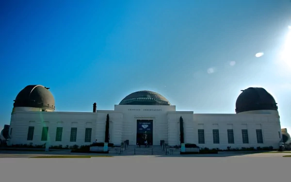 4K Ultra HD image of the iconic Los Angeles observatory under a clear, sunny sky, showcasing its distinct domed, man-made structure.
