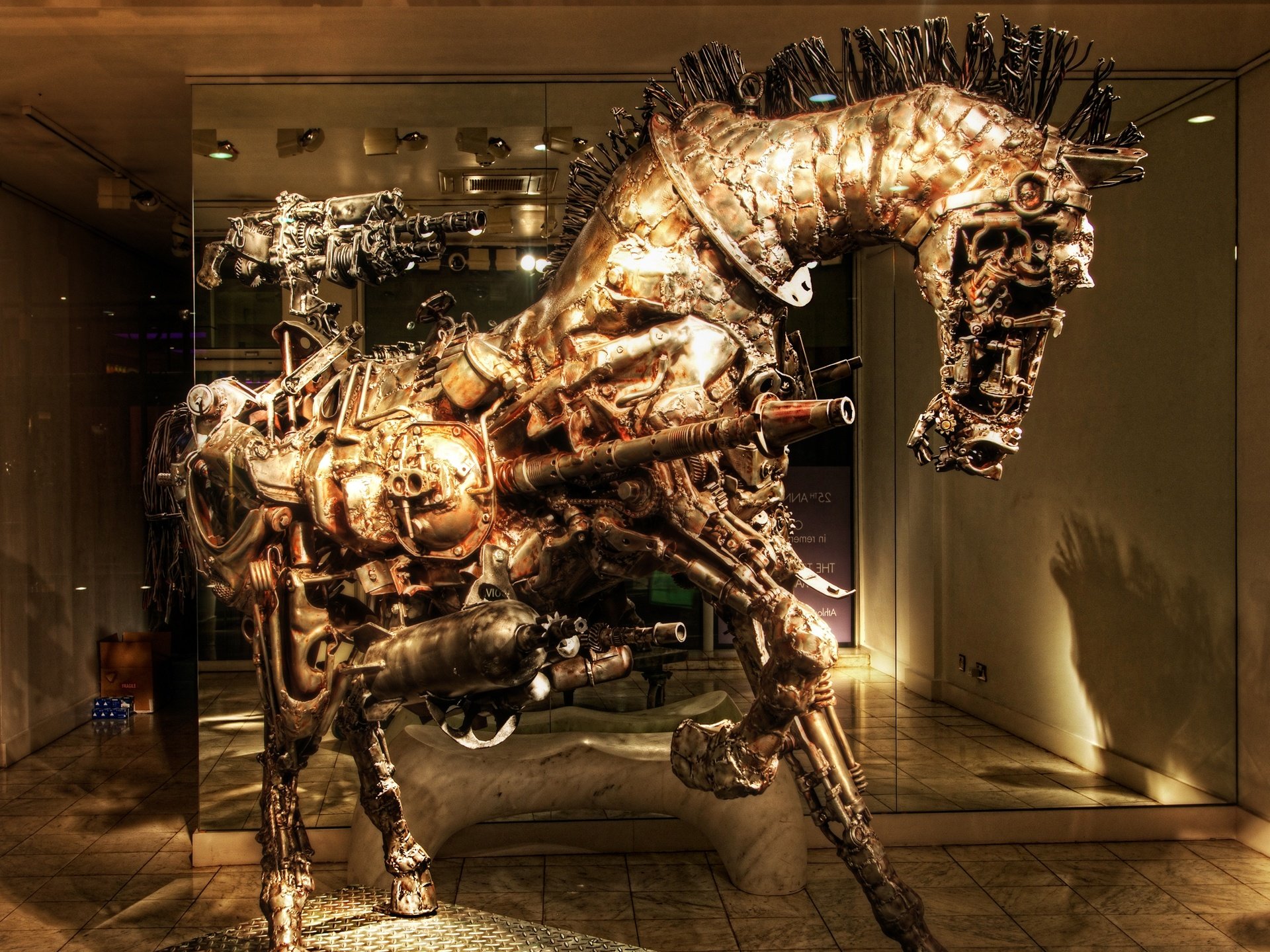 A striking steampunk-inspired sculpture of a horse, crafted from metallic components, showcased in a modern setting. This captivating image serves as a dramatic HD desktop wallpaper.