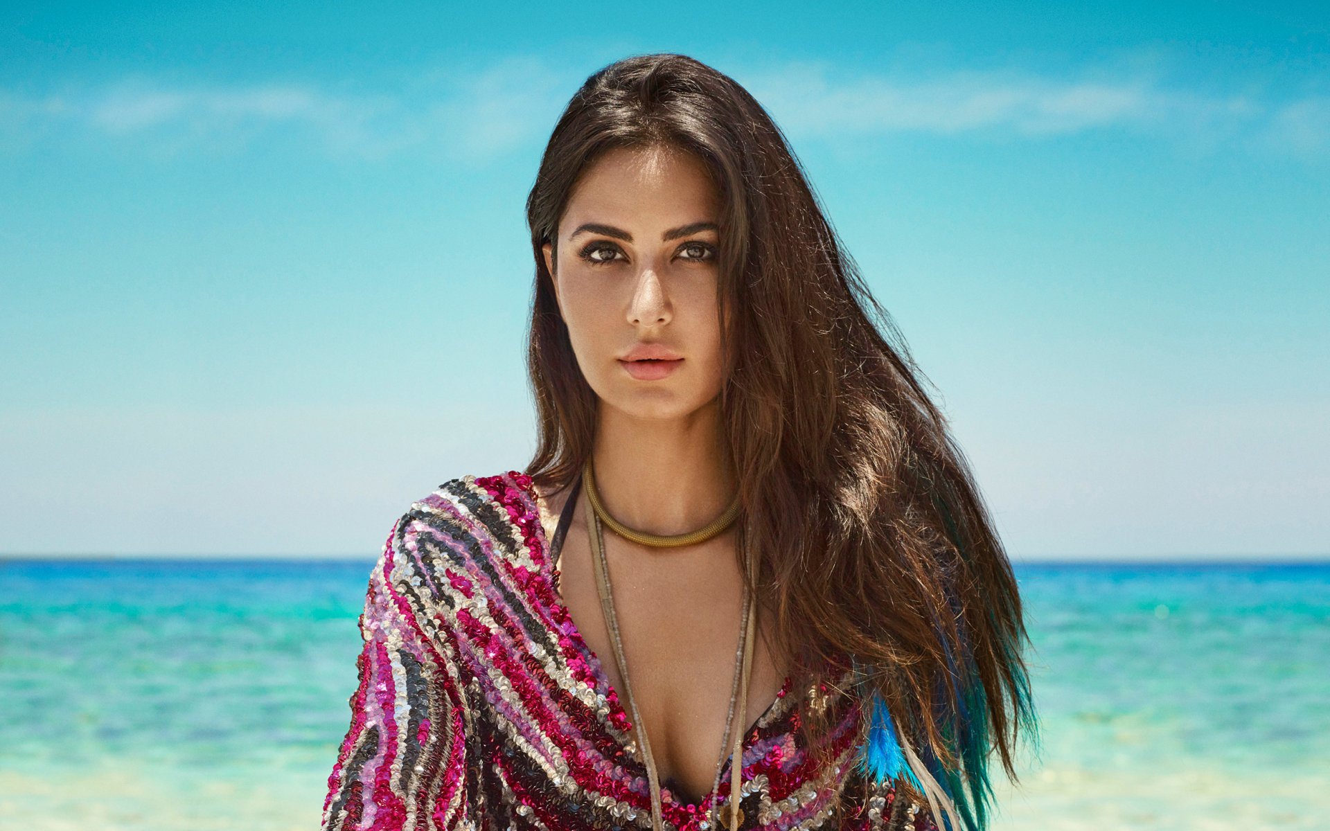 4K Ultra HD desktop wallpaper featuring celebrity Katrina Kaif against a serene ocean backdrop under a clear blue sky.