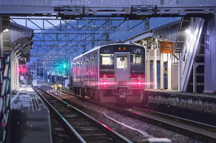 Anime-style train arrives at a snowy railroad station under a twilight sky, captured in HD for a vibrant PC desktop wallpaper background.