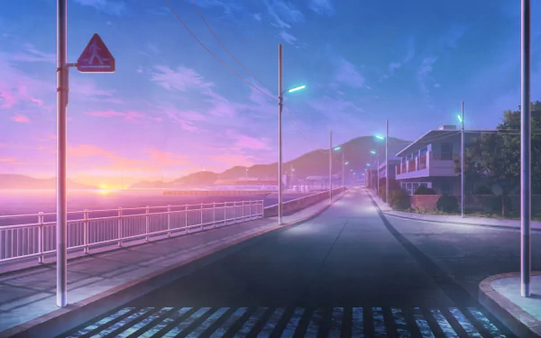 A high-definition anime desktop wallpaper featuring a serene coastal street at sunset, with soft pastel skies and mountains in the background.