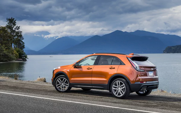 orange car SUV car Cadillac vehicle Cadillac XT4 HD Desktop Wallpaper | Background Image