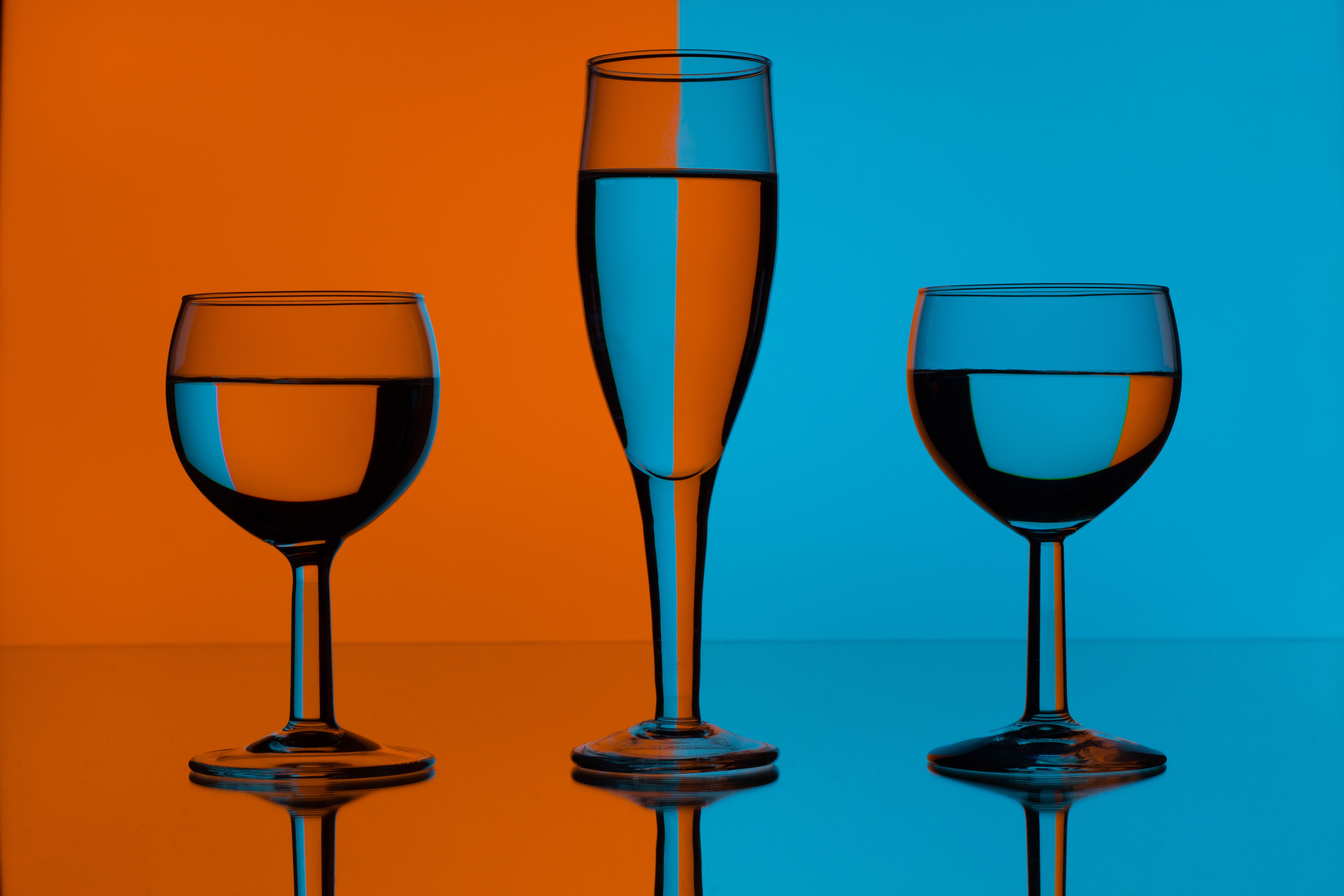 Artistic Orange and Blue Wine Glasses by Dewald Van Rensburg
