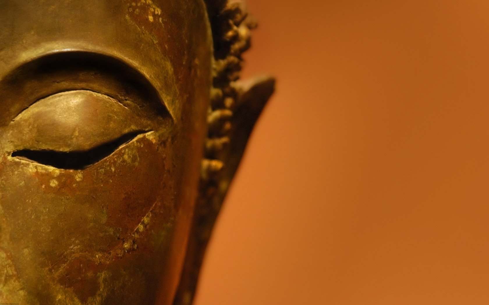 A close-up of an artistic mask with serene facial features, set against a warm background, creating an engaging HD desktop wallpaper.
