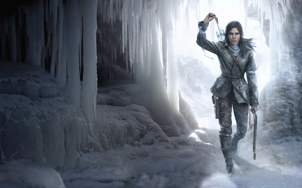HD desktop wallpaper featuring Lara Croft in a snowy, icy cave from the video game Rise of the Tomb Raider, holding a light and a climbing axe.