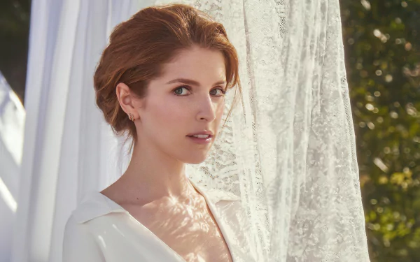 Portrait of American actress Anna Kendrick with blue eyes and red hair, captured in soft natural light, presented as a 4K Ultra HD desktop wallpaper.