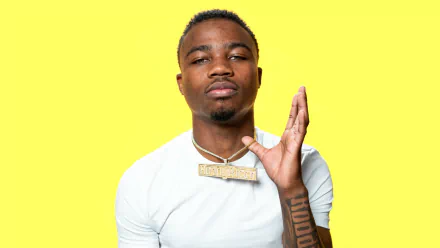 HD desktop wallpaper featuring a person posing with a yellow background.