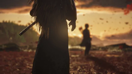4K Ultra HD desktop wallpaper of Jin Sakai from the video game Ghost of Tsushima: silhouetted samurai with katana in foreground, opponent blurred at sunset amid falling leaves.