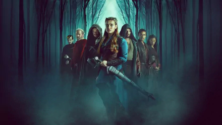 HD desktop wallpaper of Katherine Langford in Cursed (2020), surrounded by other characters in a mystical forest setting.