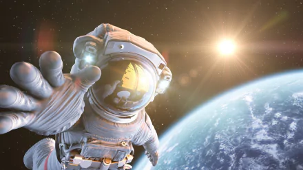 Sci‑Fi astronaut reaching toward the viewer above a blue planet with a bright sun flare — HD PC desktop wallpaper and background.