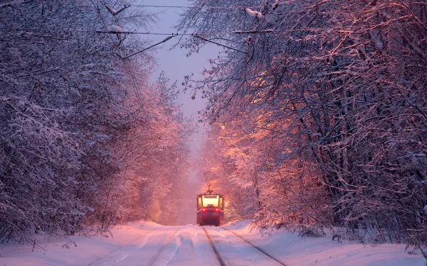 A winter scene with a snow-covered vehicle and tram, designed as an HD desktop wallpaper and background.