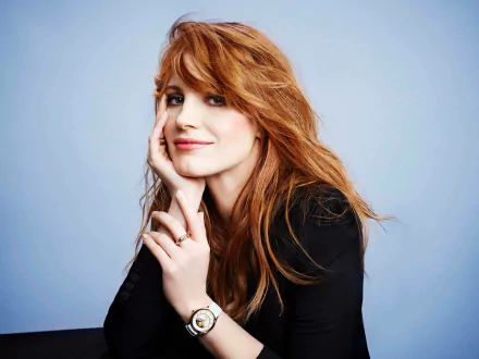 Portrait of American redhead actress Jessica Chastain with a soft smile, captured in stunning 8K Ultra HD quality for a PC desktop wallpaper background.