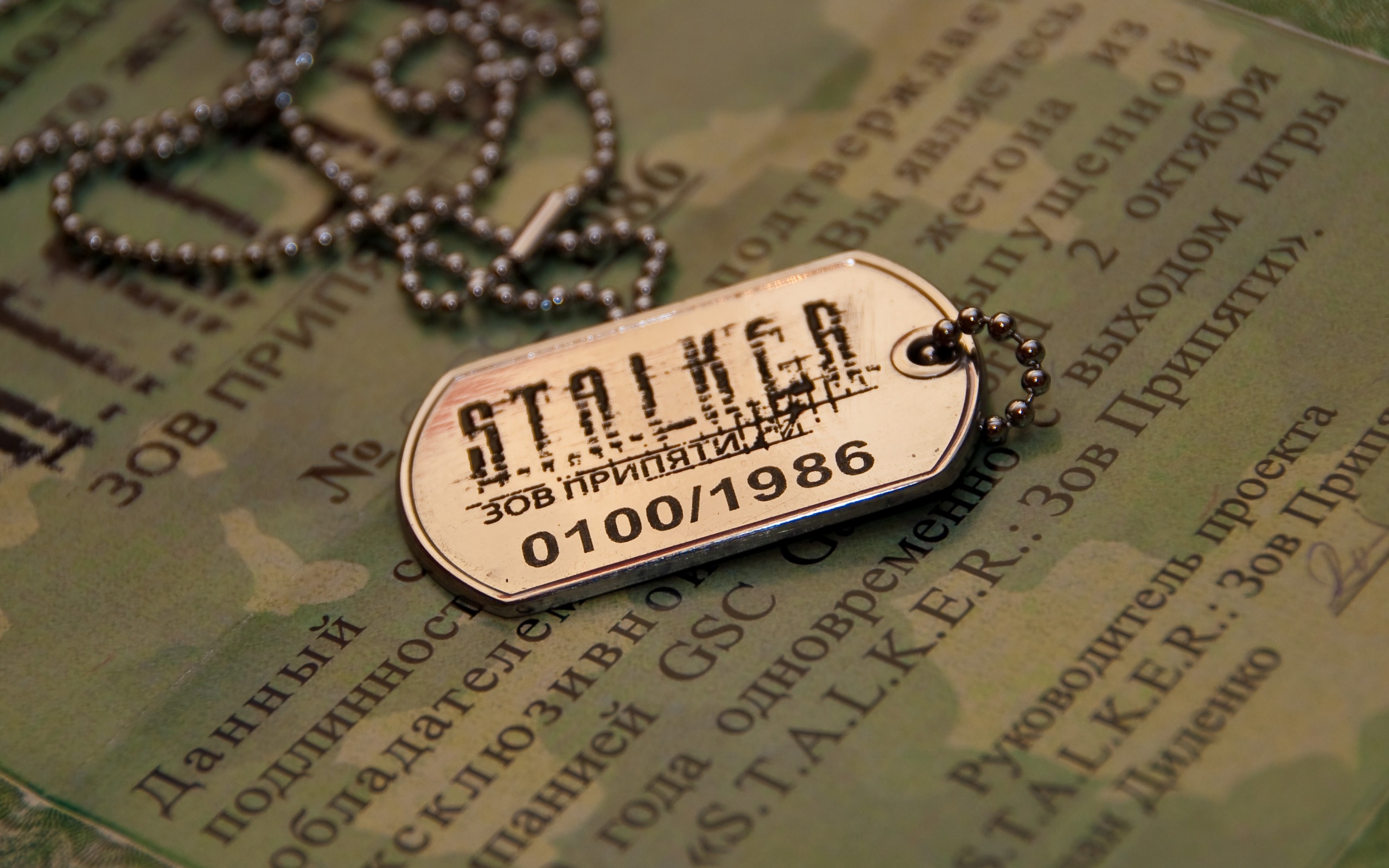 S.T.A.L.K.E.R. themed desktop wallpaper showcasing a dog tag, perfect for video game fans.
