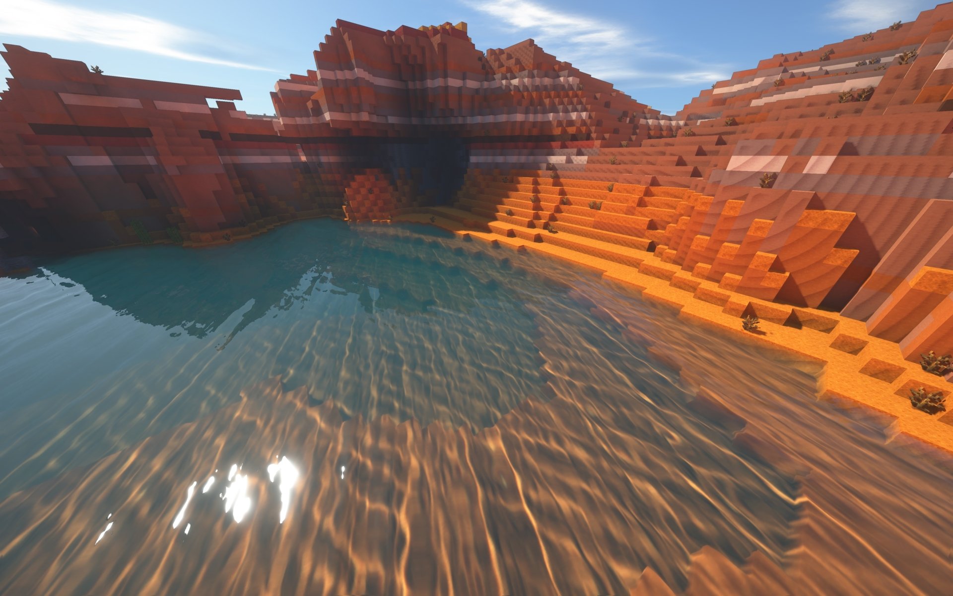 4K Ultra HD Minecraft landscape featuring a serene water body surrounded by rugged, blocky red rock formations under a clear sky, designed for PC desktop background.