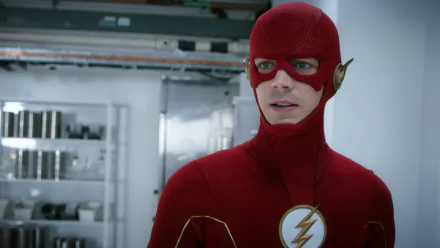 HD desktop wallpaper of Barry Allen from The Flash (TV, 2014) in his red suit with lightning emblem, standing in a bright high-tech lab.