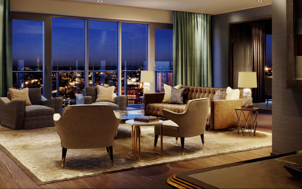 4K Ultra HD PC desktop wallpaper: modern man-made living room interior with floor-to-ceiling windows showing a city skyline, neutral sofas, armchairs, rug and warm lamps.