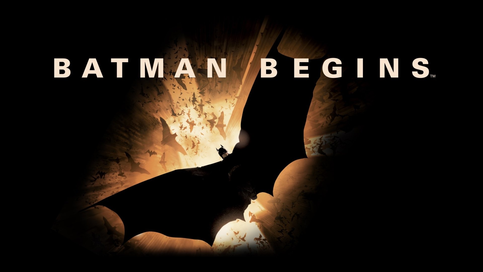 HD PC desktop wallpaper for the movie Batman Begins: silhouetted bat emblem against a fiery backdrop with the BATMAN BEGINS title.