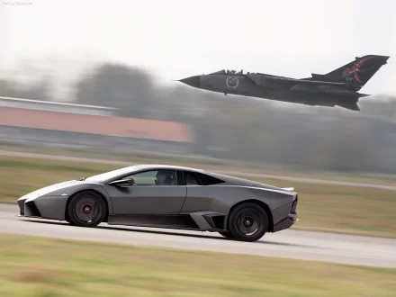 A sleek grey Lamborghini Reventon races along the ground as a jet aircraft soars above, creating a dynamic contrast of speed and power in this HD wallpaper.