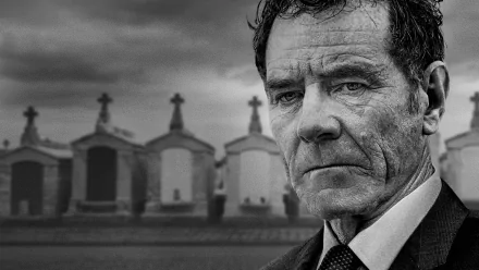 HD desktop wallpaper featuring Bryan Cranston from Your Honor with a solemn expression, set against a backdrop of mausoleums.