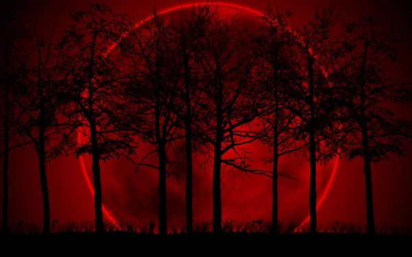 A striking artistic depiction of a large red moon behind silhouetted trees, creating a dramatic and atmospheric HD PC desktop wallpaper.