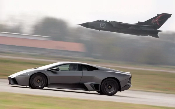 A sleek grey Lamborghini Reventon races along the ground as a jet aircraft soars above, creating a dynamic contrast of speed and power in this HD wallpaper.