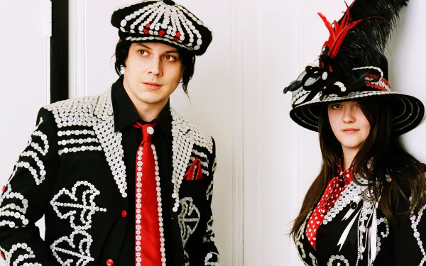 HD wallpaper featuring members of The White Stripes in patterned black-and-white attire with red accents.