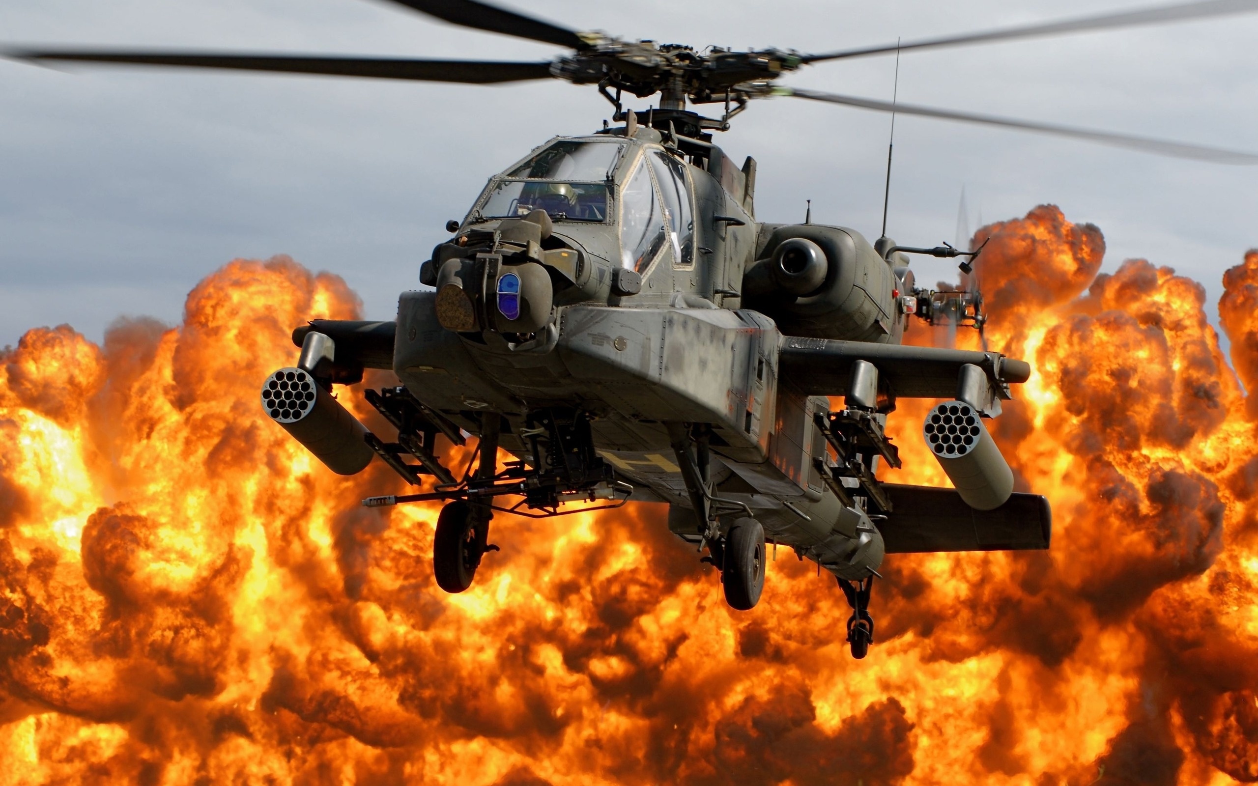 Boeing AH-64 Apache military helicopter on desktop wallpaper.