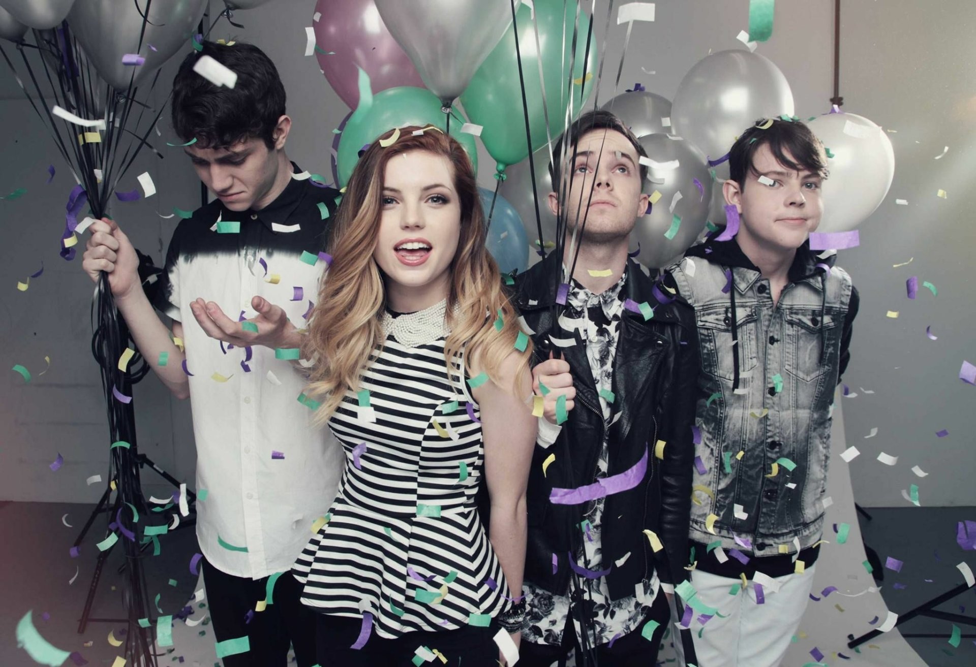 HD desktop wallpaper featuring Echosmith band members with Sydney Sierota in the foreground, surrounded by balloons and confetti.
