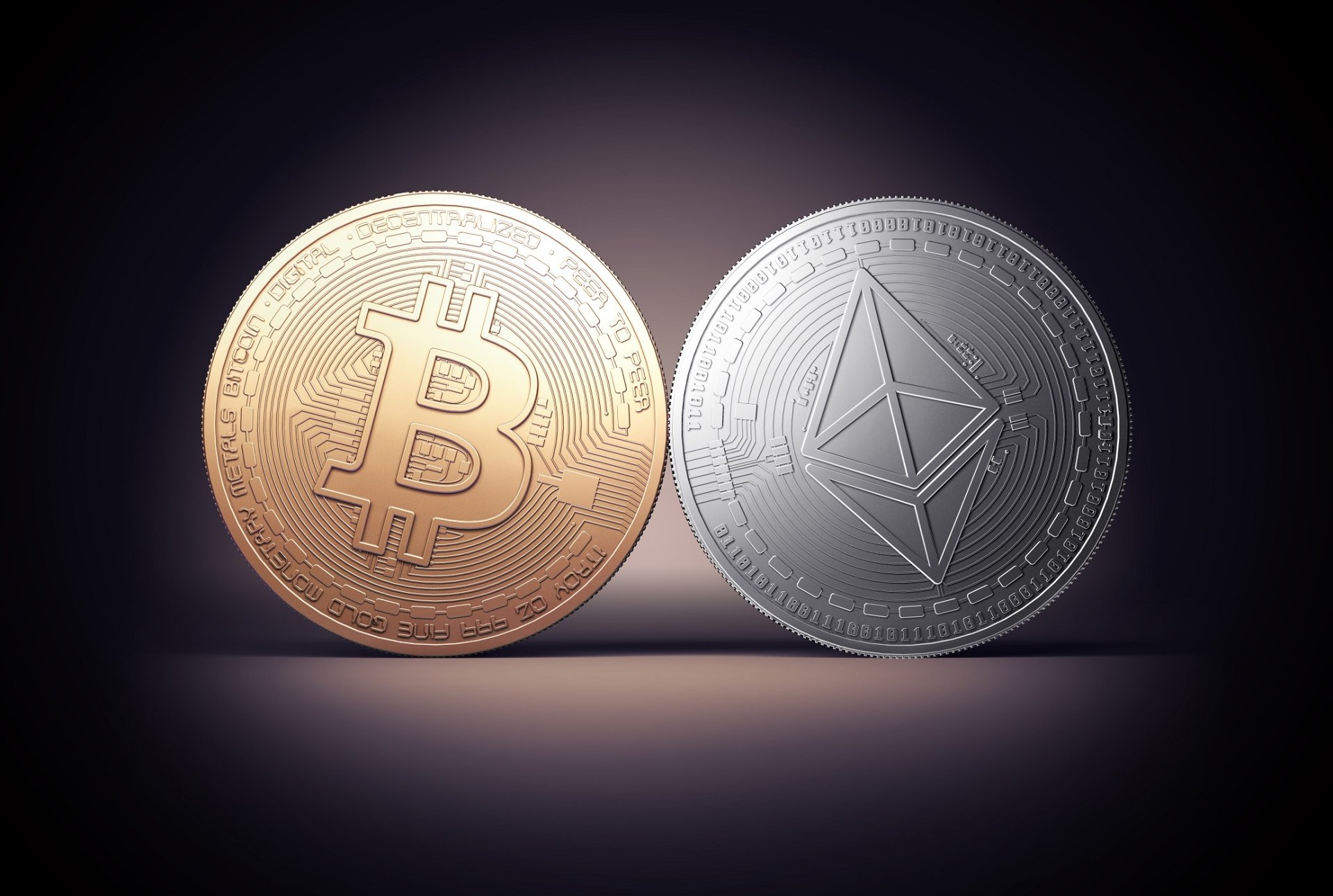 HD desktop wallpaper featuring a Bitcoin and an Ethereum coin side by side on a dark background, symbolizing cryptocurrency.