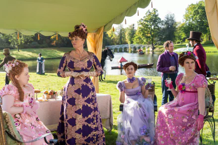HD desktop wallpaper from Bridgerton featuring elegantly dressed characters in a vibrant garden party setting.