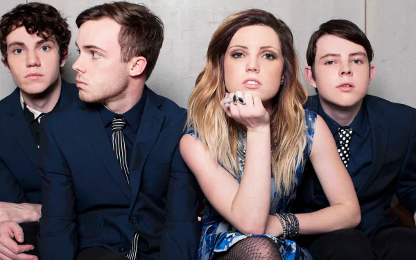 HD desktop wallpaper featuring Sydney Sierota and Echosmith, showcasing the band members in stylish attire against a neutral backdrop. A vibrant addition for music fans.